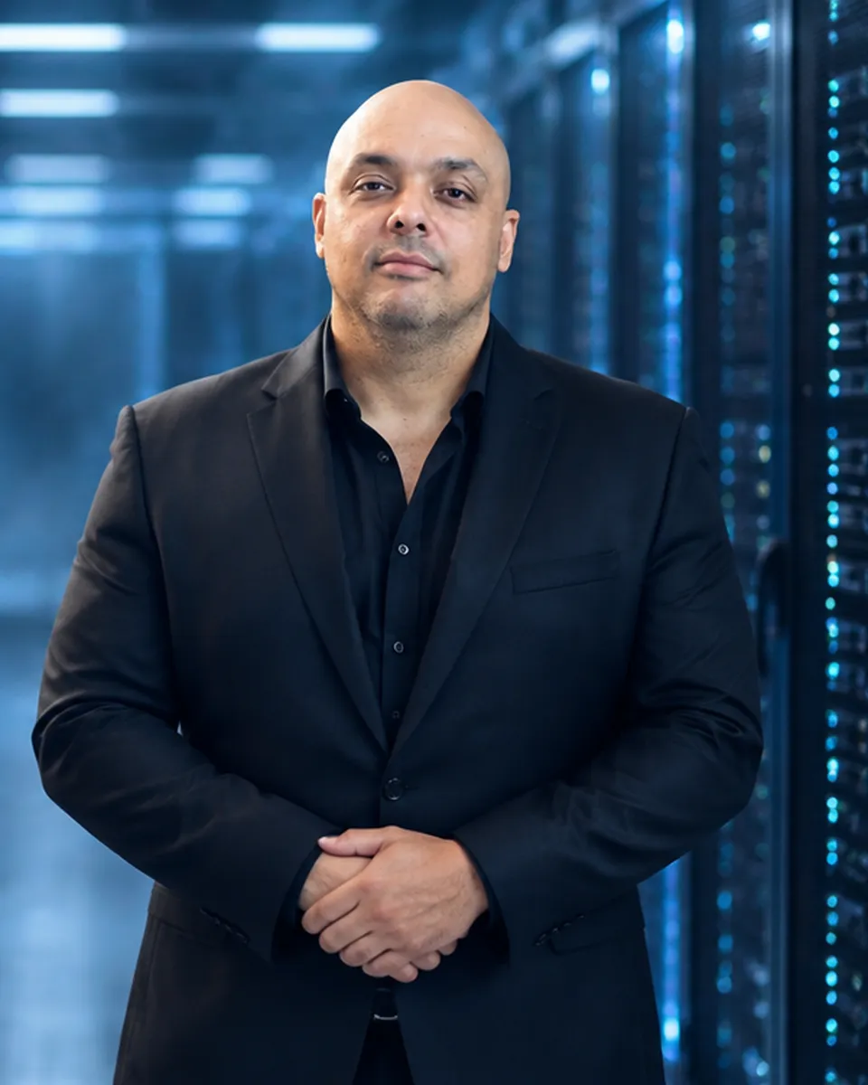 Wesley Sing, founder and CEO of Appetite Technology, in a black suit in a server room